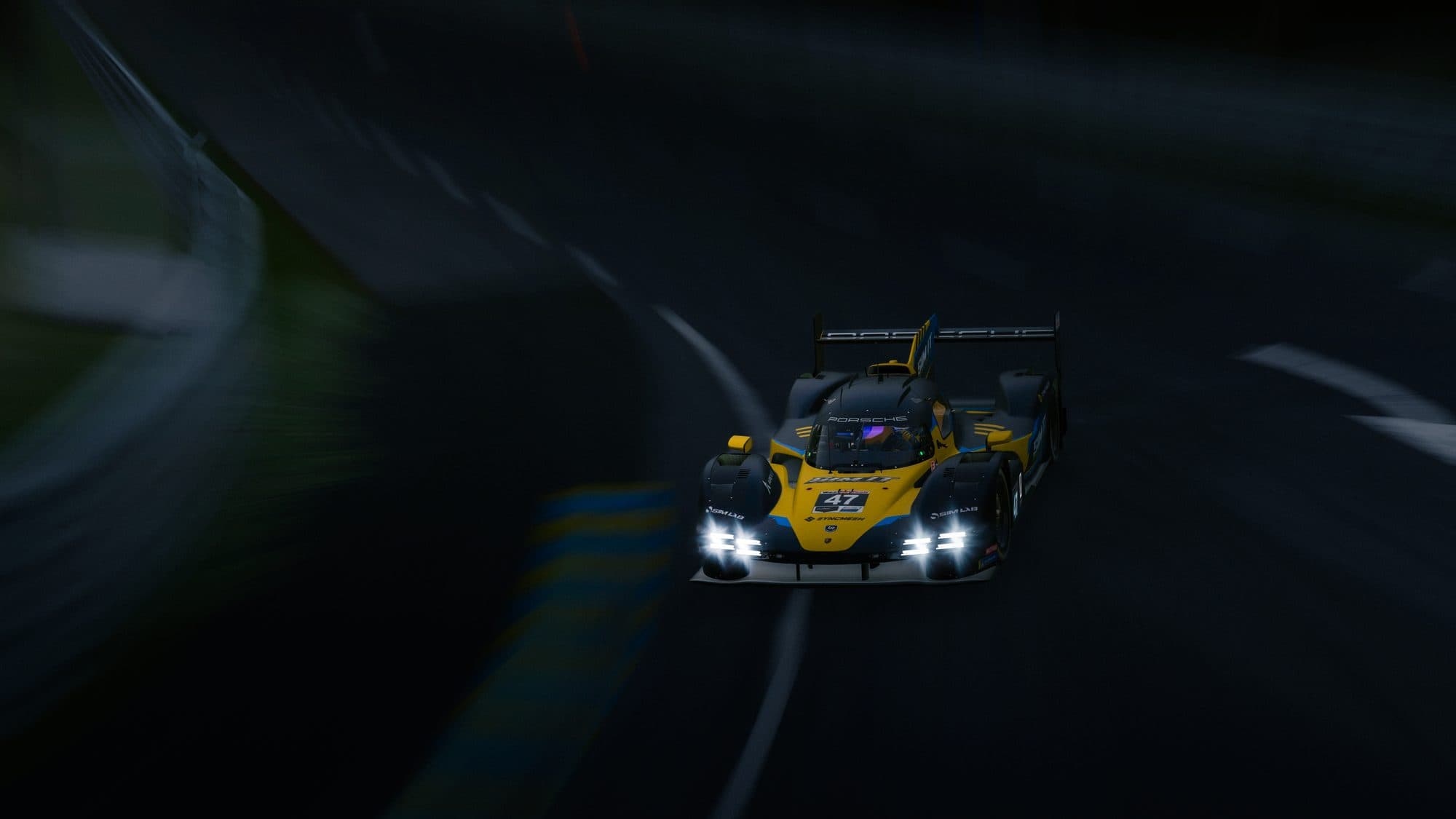 The Sim It car at night with its headlights on